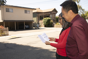 couple looking at earthquake field guide